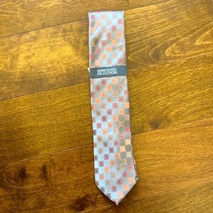 A Kenneth Cole reaction tie. It has grey a checkered pattern.